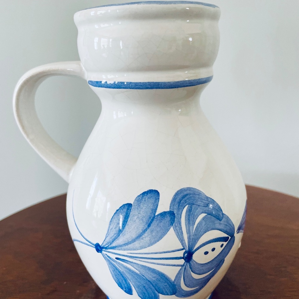 Hand-painted ceramic pitcher/creamer with blue floral motifs, small creamer